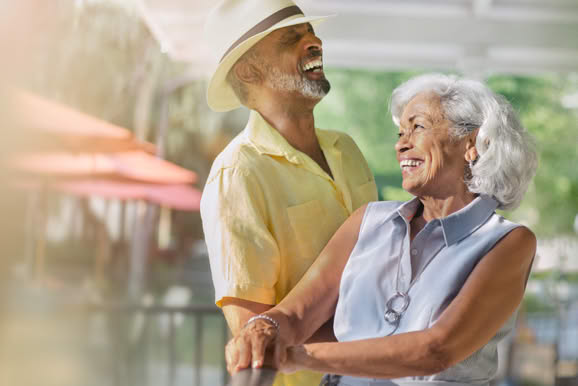 Warm lifestyle moment capturing connection and relaxation within a hospitality environment.