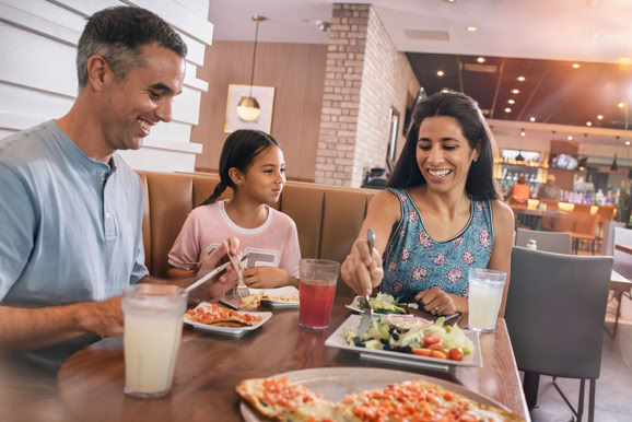 Guests enjoying a relaxed dining experience, showcasing food, atmosphere, and social interaction.