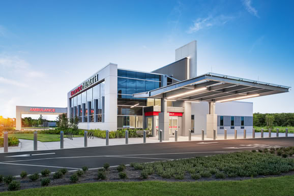 Healthcare facility exterior showcasing modern design and accessibility for outpatient services.